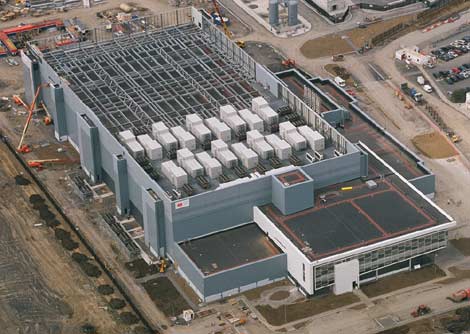 An aerial view of the Microsoft data center in Dublin showing the rooftop air handler units atop the first phased of the facility, as well as the vacant roof space available for additional air handlers as the remainder of the facility is built out.