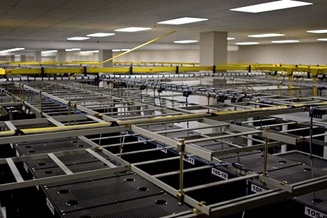 A view of the rows of racks packing a pod inside the QTS Downtown Atlanta data center. 