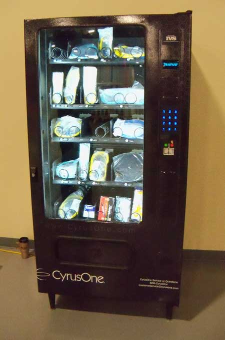 A vending machine is fully stocked with a variety of cables and connectors that customers may need, provided at cost by CyrusOne. (Photo: Rich Miller)