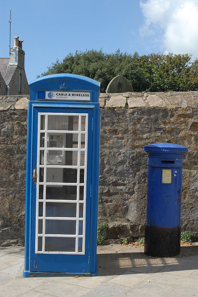 Telephone Box in St Anne on the Island of Alderney, part of the Bailiwick of Guernsey