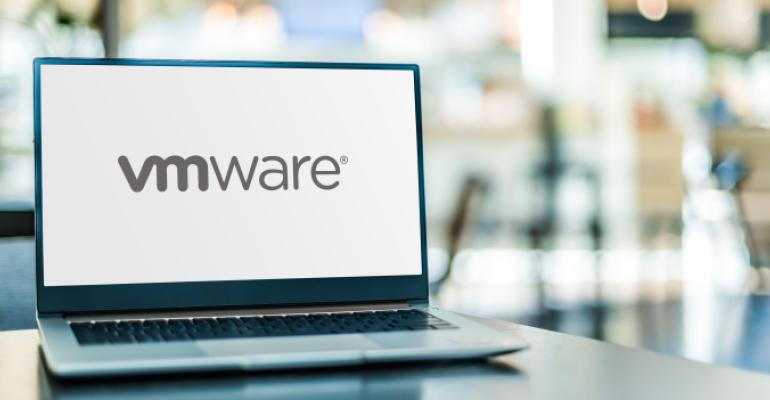 Laptop computer displaying logo of VMware, a software company providing cloud computing and virtualization software