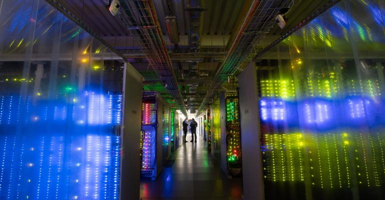 image of the inside of a data center with blue lighting