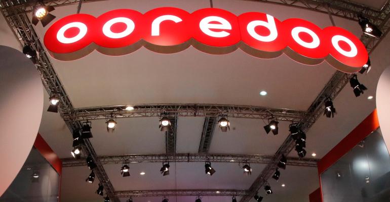 Image of the logo of the firm OOredoo with white letters outlined in red.