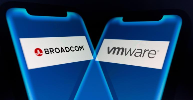 Illustration: In-camera multiple exposure image shows logos of Broadcom (NASDAQ: AVGO), a global technology company, and VMware, a provider of multi-cloud services, on smartphone.
