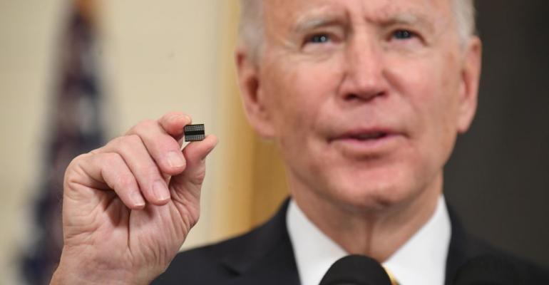 Biden holding computer chip