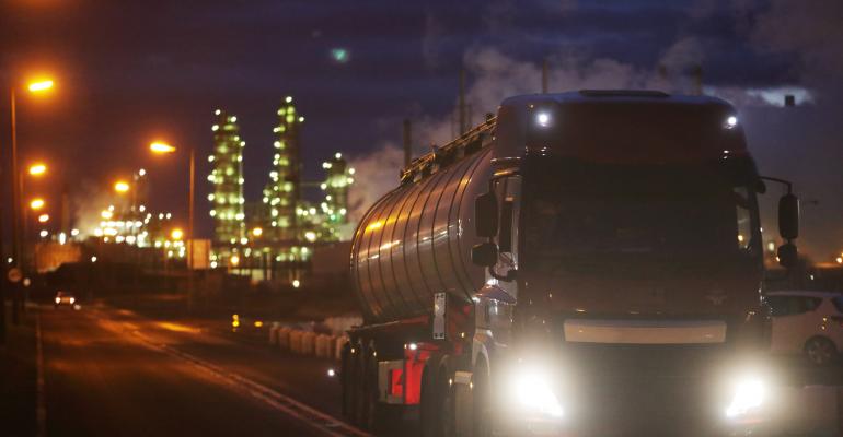 Truck carrying oil leaving refinery 