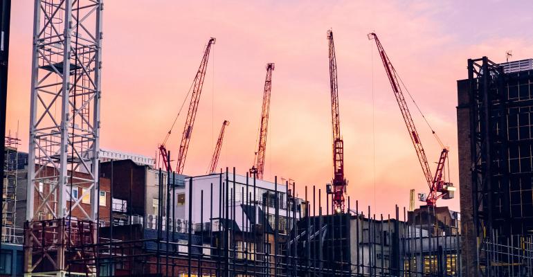 Evening cranes over a data center construction site