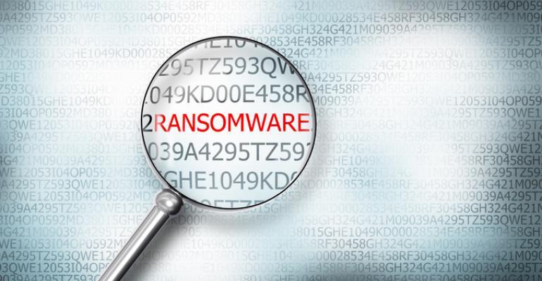 Illustration of a magnifying glass focused on the word ransomware