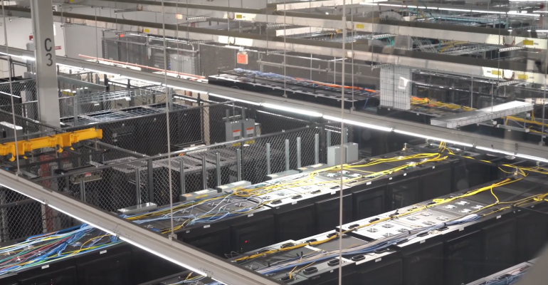 Overhead view of rows of IT racks inside Evoque's data center in Ashburn, Virginia