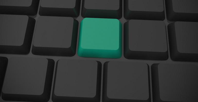 black keyboard with green key