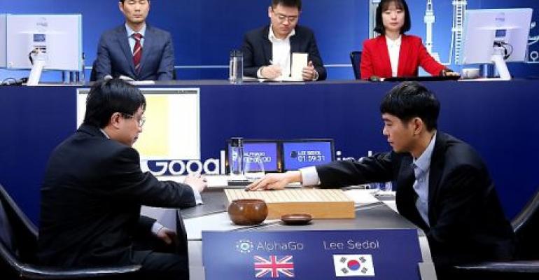 South Korean professional Go player Lee Se-Dol puts his first stone against Google's Artificial Intelligence program, AlphaGo, in March 2016 in Seoul. He lost the five-match series.