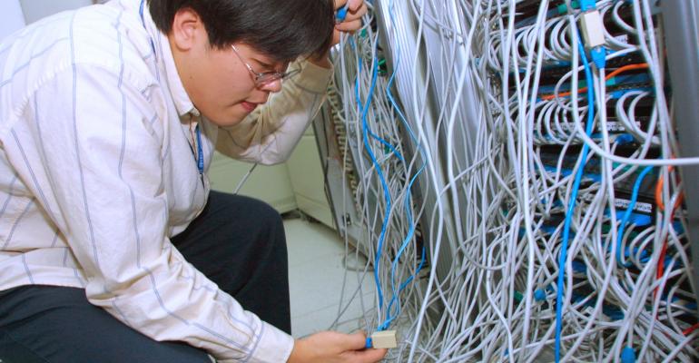 South Korean engineer checks systems after a worm called "SQL Slammer" attacked internet servers in the country in 2003