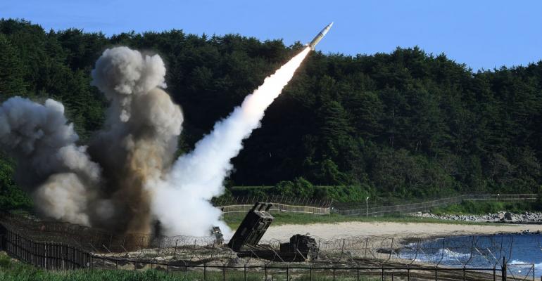 In this handout photo released by the South Korean Defense Ministry,  U.S.  M270 Multiple Launch Rocket System firing an MGM-140 Army Tactical Missile during a U.S. and South Korea joint missile drill aimed to counter North Korea's intercontinental ballistic missile test on  July 5, 2017 in East Coast, South Korea.
