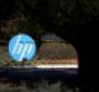 The Hewlett Packard (HP) logo is displayed in front of the office complex
