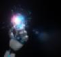 robot hand holds glowing lightbulb