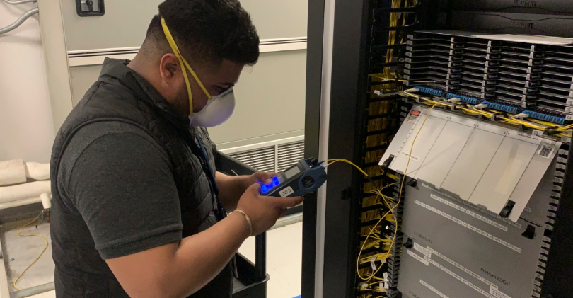 A CoreSite engineer testing a cross-connect for acceptable light loss at the company’s data center in Chicago.