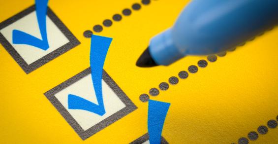 yellow checklist with blue marker