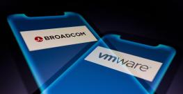 Illustration: In-camera multiple exposure image shows logos of Broadcom (NASDAQ: AVGO), a global technology company, and VMware, a provider of multi-cloud services, on smartphone. 