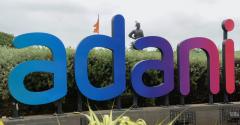 A signage of Adani group is pictured outside the Chatrapati Shivaji Mumbai International Airport in Mumbai