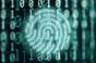 A glowing fingerprint symbol against binary code, representing the role of network zoning in internet security.