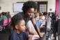 girls who code child coding on computer