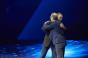 VMware CEO Pat Gelsinger and AWS CEO Andy Jassy hug on stage at VMworld 2018 in Las Vegas
