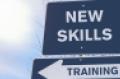 "New Skills" sign on top of "Training" sign