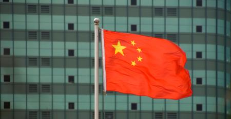 Chinese flag in front of building