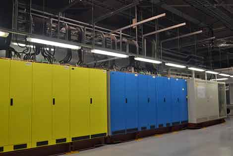 Inside the facility, the dual power systems are color coded with yellow and blue. (Photo by Colleen Miller.) 