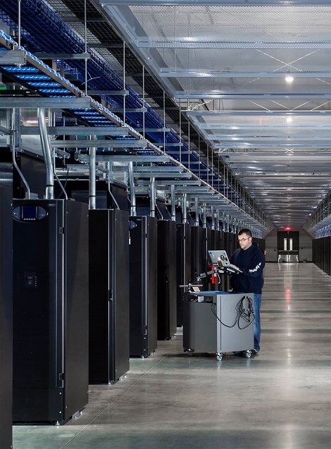 A technician at work in a data hall at Facebook's Altoona data center. (Photo: @2014 Jacob Sharp Photography)