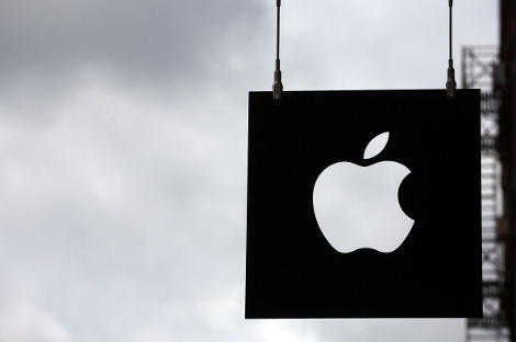 The Apple logo hangs in front of an Apple store in New York City. (Photo by Spencer Platt/Getty Images)