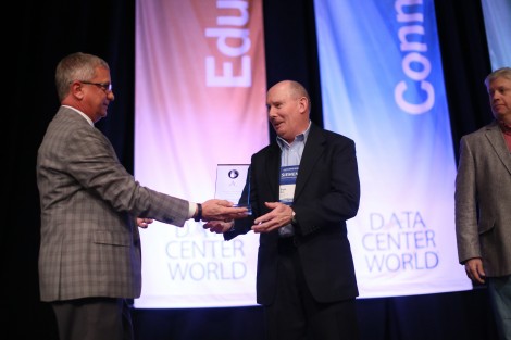 AFCOM President Tom Roberts presents an award to Bryon Miller, SVP of operations at Fortrust. Miller was one of the three finalists in this year’s Data Center Manager of the Year awards.